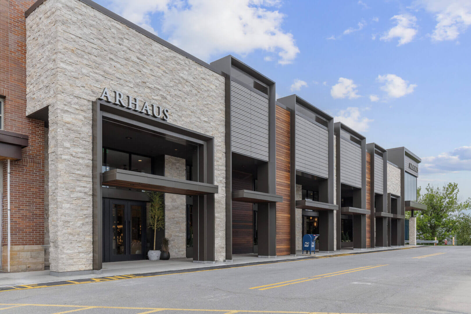 Modern commercial building with stone facade.