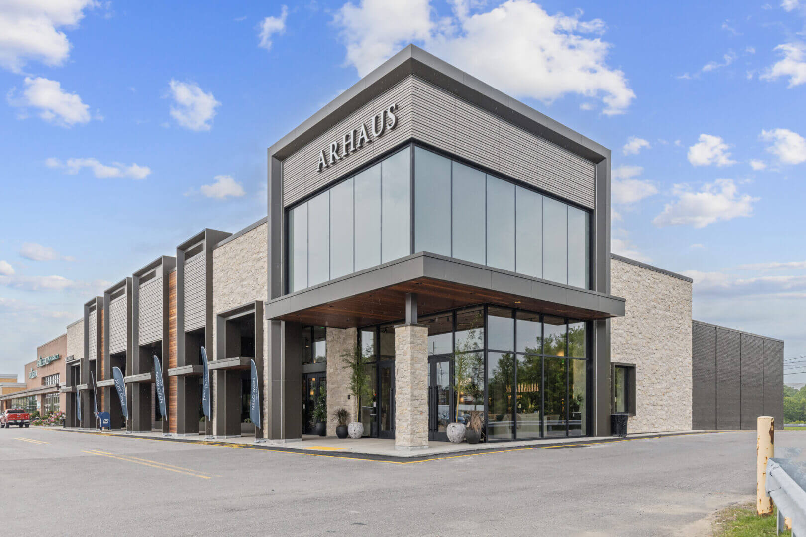 Modern store exterior with large glass windows.