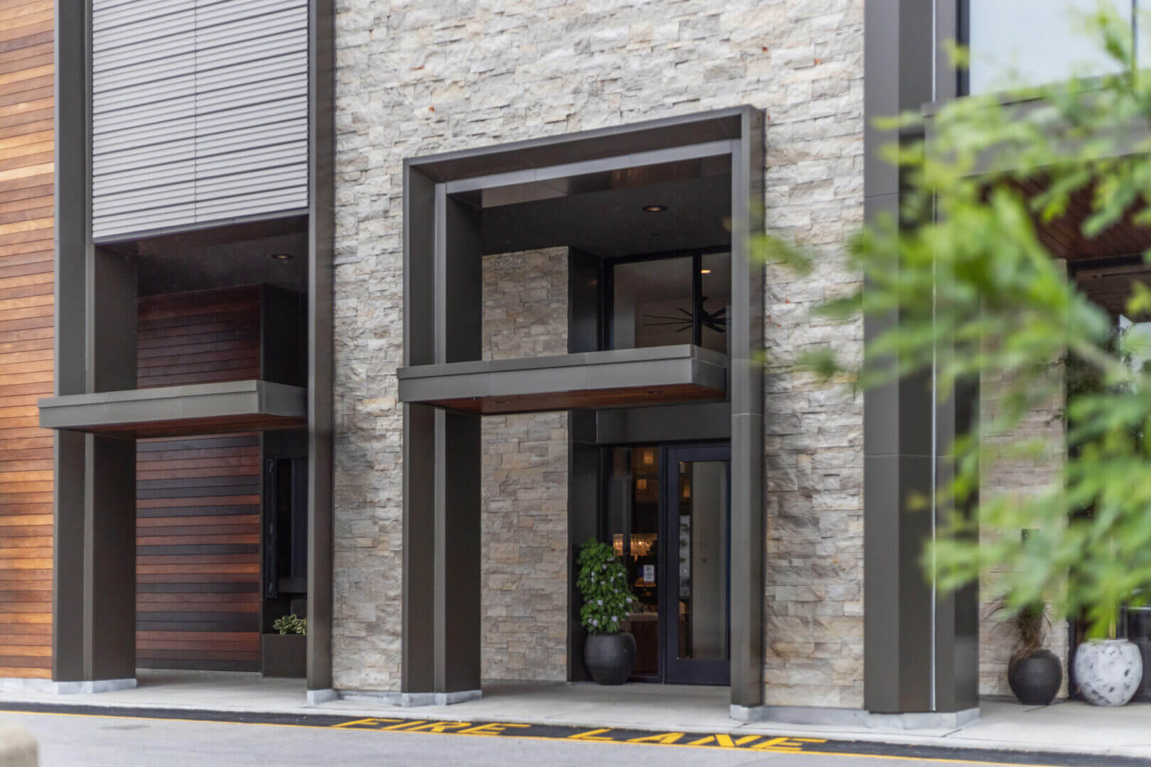 Modern building entrance with stone facade
